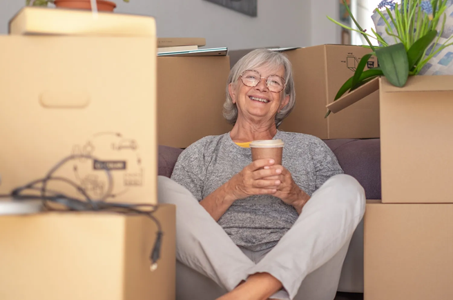 Labeling moving boxes during a senior relocation in Powell, Ohio
